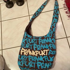 It’s a blue brown white purse has so much room